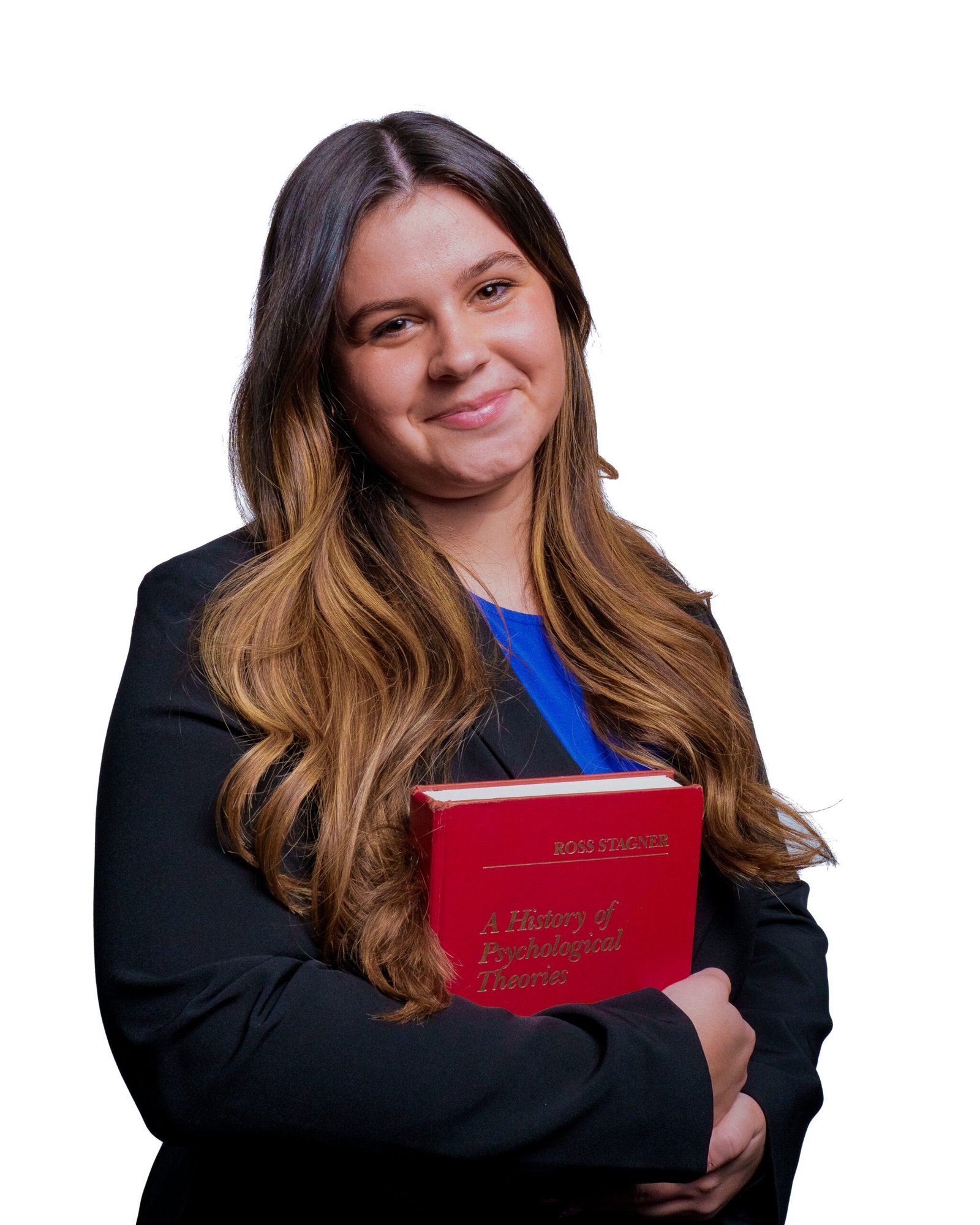 Young woman in a blazer holding a psychology textbook.
